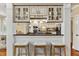 Entertain in this kitchen with a bar area, complete with stool seating, granite countertops, and custom wine storage at 7336 Barham Hollow Dr, Wake Forest, NC 27587