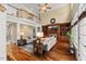 Spacious living room with hardwood floors, built-in shelving, fireplace, and ample natural light at 7336 Barham Hollow Dr, Wake Forest, NC 27587