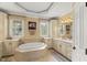 Enjoy the convenience of a jetted tub, separate vanities, and custom cabinetry in this spacious primary bathroom at 7336 Barham Hollow Dr, Wake Forest, NC 27587
