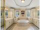Relax in the primary bathroom with a jetted tub, dual vanities, and plenty of storage space for a spa-like experience at 7336 Barham Hollow Dr, Wake Forest, NC 27587
