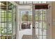 Inviting porch with outdoor seating and a view of the wooded backyard at 7336 Barham Hollow Dr, Wake Forest, NC 27587