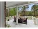 Relaxing back porch with comfortable seating perfect for enjoying the outdoors at 7336 Barham Hollow Dr, Wake Forest, NC 27587