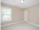 Cozy bedroom with natural light and neutral carpet and walls at 800 Laurel Garden Way, Cary, NC 27513