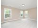 Bright and airy bedroom with large windows and plush carpet at 800 Laurel Garden Way, Cary, NC 27513