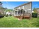 Exterior view of the home's back featuring a deck and screened in porch at 800 Laurel Garden Way, Cary, NC 27513