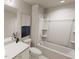 Clean white bathroom showcasing a bathtub with shower, modern fixtures, and neutral tones for a relaxing ambiance at 817 Central Pk Dr, Raleigh, NC 27604
