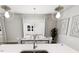 Elegant dining area with stylish chandelier, sleek table setting, and natural light at 817 Central Pk Dr, Raleigh, NC 27604