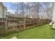 Large backyard with wood fencing, offering privacy and space for outdoor activities at 8308 Buck Crossing Dr, Durham, NC 27713