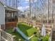 Lush backyard features a deck, a slide, and ample space for outdoor enjoyment at 8308 Buck Crossing Dr, Durham, NC 27713