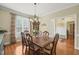 Spacious dining room with hardwood floors and natural light, great for entertaining at 8308 Buck Crossing Dr, Durham, NC 27713