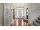 Well-lit foyer features hardwood floors and detailed trim and natural light at 8308 Buck Crossing Dr, Durham, NC 27713