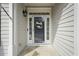 Inviting front entrance with a decorative wreath, sidelights and elegant details at 8308 Buck Crossing Dr, Durham, NC 27713