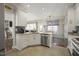 Bright kitchen with stainless steel appliances and granite countertops at 8308 Buck Crossing Dr, Durham, NC 27713