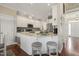 Modern kitchen featuring stainless steel appliances, granite countertops, and breakfast bar seating at 8308 Buck Crossing Dr, Durham, NC 27713