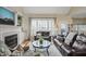 Inviting living room with a fireplace, large windows, and comfortable seating area at 8308 Buck Crossing Dr, Durham, NC 27713