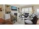 Comfortable living room featuring a fireplace, built-in shelving, and lots of natural light at 8308 Buck Crossing Dr, Durham, NC 27713