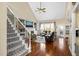 Elegant living room with hardwood floors, vaulted ceiling, and a cozy fireplace at 8308 Buck Crossing Dr, Durham, NC 27713