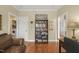 Cozy living room with hardwood floors and built in bookcase at 8308 Buck Crossing Dr, Durham, NC 27713