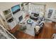 Bright living room featuring hardwood floors, fireplace, and large windows with backyard views at 8308 Buck Crossing Dr, Durham, NC 27713