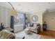 Comfortable living room featuring a couch, natural light, and neutral color palette at 8308 Buck Crossing Dr, Durham, NC 27713