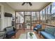 Relaxing screened porch with comfortable seating, ceiling fan, and serene backyard view at 8308 Buck Crossing Dr, Durham, NC 27713