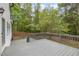 A spacious outdoor deck overlooks the fenced backyard, perfect for entertaining and enjoying the outdoors at 9332 Carley Cir, Garner, NC 27529