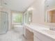 Bright bathroom with a soaking tub, shower, and double vanity with quartz countertops at 9332 Carley Cir, Garner, NC 27529