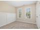 This cozy bedroom boasts neutral walls, carpet flooring, and an abundance of natural light streaming through the two windows at 9332 Carley Cir, Garner, NC 27529