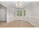 Bright dining room featuring a bay window, new lighting, and neutral paint at 9332 Carley Cir, Garner, NC 27529