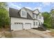 Charming two-story home with two-car garage, well-maintained lawn and manicured landscaping at 9332 Carley Cir, Garner, NC 27529