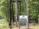 A street view with an Eastwood Homes sign, showcasing the opportunity to build your dream home on this lot at 0009 Tallulah Loop Ln, Cedar Grove, NC 27231