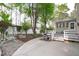 Back patio with a swing and outdoor dining, perfect for entertaining guests at 1008 Double Spring Ct, Apex, NC 27502