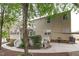 Two-story home with a lush backyard, a patio area, and a manicured garden, perfect for relaxing at 1008 Double Spring Ct, Apex, NC 27502