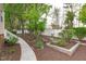 Backyard with a beautiful garden, a well-maintained lawn, and a cozy seating area at 1008 Double Spring Ct, Apex, NC 27502