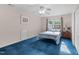 Comfortable bedroom with neutral walls, carpeted flooring, and a vintage nightstand at 1008 Double Spring Ct, Apex, NC 27502