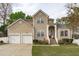 Charming two-story home featuring a two-car garage and well-manicured lawn at 1008 Double Spring Ct, Apex, NC 27502