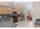 Kitchen featuring light wood cabinets, dark countertops and stainless steel appliances at 1008 Double Spring Ct, Apex, NC 27502
