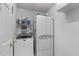 Efficient laundry room with a stacked washer/dryer and plenty of storage at 1008 Double Spring Ct, Apex, NC 27502