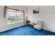 Cozy living room with blue carpet, a large window and comfortable seating at 1008 Double Spring Ct, Apex, NC 27502