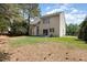 Spacious backyard featuring a patio and green lawn at 103 Woolard Way, Apex, NC 27502