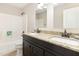 Bathroom featuring a double vanity with granite countertop and a shower and tub combination at 103 Woolard Way, Apex, NC 27502
