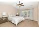 Cozy bedroom with carpet, vaulted ceilings and a large window providing natural light at 103 Woolard Way, Apex, NC 27502