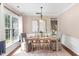 Beautiful dining room with wood floors, neutral walls, and ample natural light at 103 Woolard Way, Apex, NC 27502