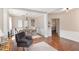 Elegant dining room featuring wood floors, neutral walls, and an open living area at 103 Woolard Way, Apex, NC 27502