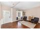 Welcoming living room with wood floors, neutral walls, and an open floor plan at 103 Woolard Way, Apex, NC 27502