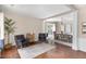 Bright living room with wood floors, neutral walls, and an open dining area at 103 Woolard Way, Apex, NC 27502