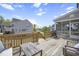 Multi-level back deck with seating, grill, and stairs to backyard at 105 Smoky Emerald Way, Holly Springs, NC 27540
