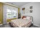 Comfortable bedroom with large window and decorative accents at 105 Smoky Emerald Way, Holly Springs, NC 27540