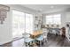 Cozy breakfast nook with table, chairs, and sliding door to deck at 105 Smoky Emerald Way, Holly Springs, NC 27540