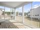 Relaxing screened porch with views of the backyard and neighborhood at 105 Smoky Emerald Way, Holly Springs, NC 27540